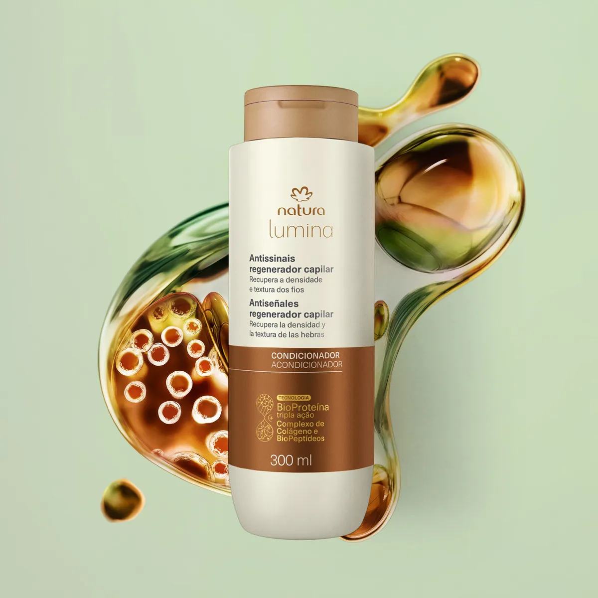 frasco do Natura Lumina Antissinais Regenerador Capilar – Condicionador 300 ml em close, sobre fundo verde com textura fluida que remete à BioProteína